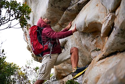 Buy stock photo Man, rock climbing and fitness for adventure outdoor, freedom and journey with travel in mountains. Determination, concentration and trekking with challenge, peak and active on rough terrain