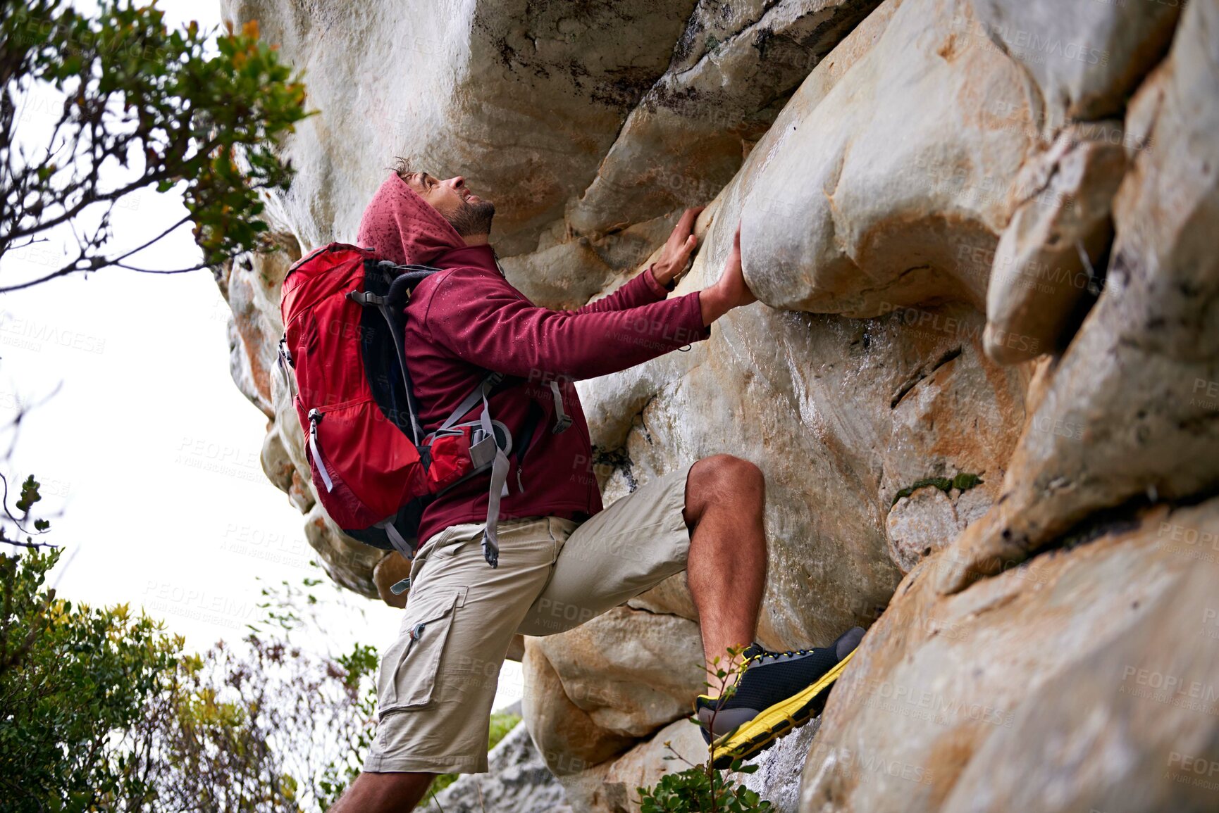 Buy stock photo Man, rock climbing and fitness for adventure outdoor, freedom and journey with travel in mountains. Determination, concentration and trekking with challenge, peak and active on rough terrain