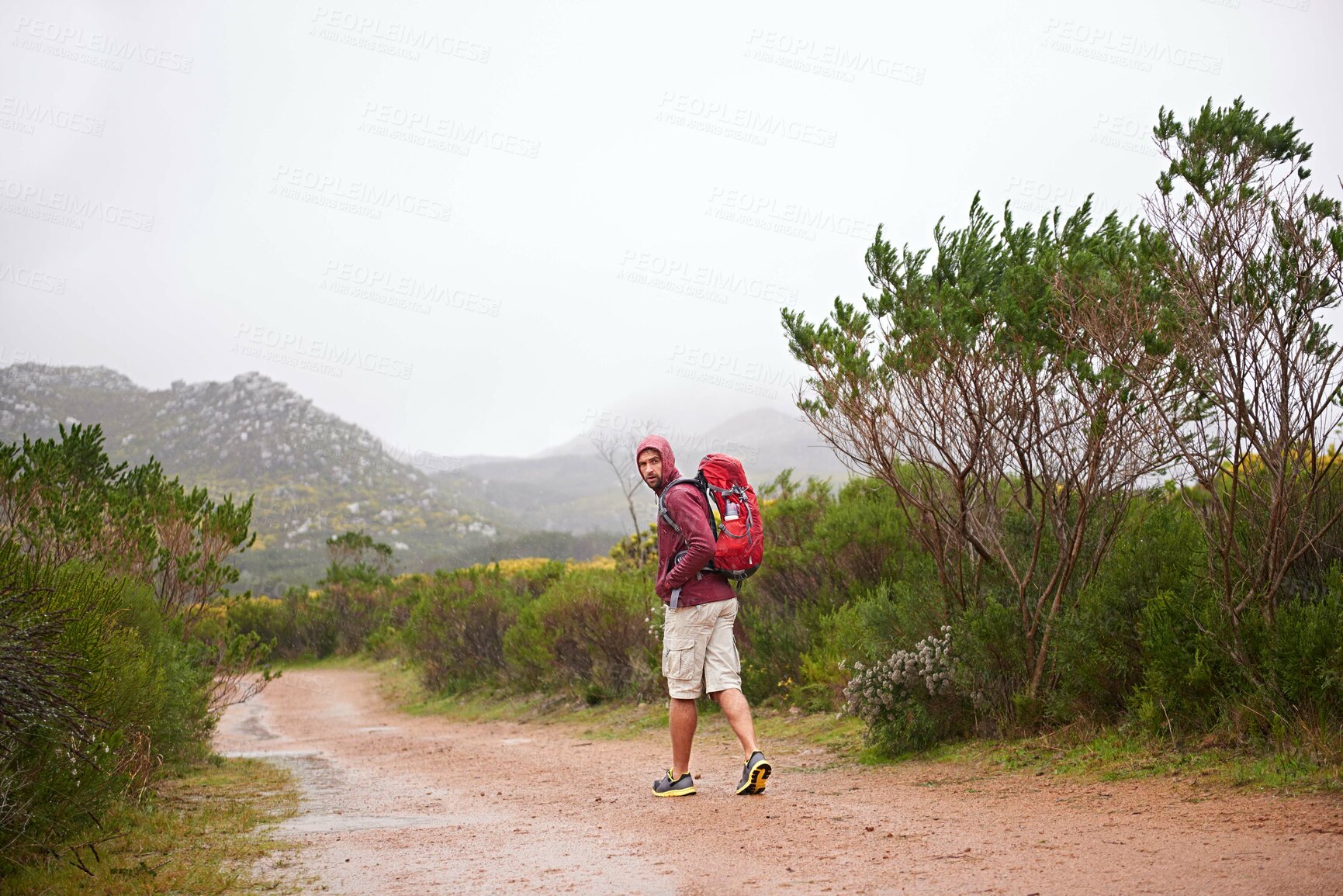 Buy stock photo Hiking, man and walking outdoor for travel, backpack and nature for fresh air and fitness on trip. Trekking, mountain trail and rough terrain for adventure, journey and exercise in environment