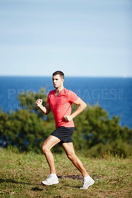 Buy stock photo Sporty, man and jogging in nature for fitness, health and wellness in outdoor for workout or exercise. Male athlete, training and cardio with endurance, muscles and strength for healthy living or gym