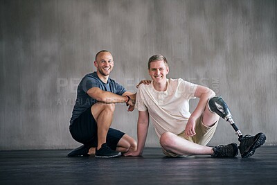 Buy stock photo Physiotherapist, person with a disability and prosthetic leg and smile in physiotherapy, studio and gym. Male people, trainer and amputee for wellness, fitness and exercise in sports center
 