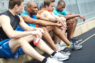 Buy stock photo Sports, break and group of men by stadium for race track, marathon or running challenge training. Fitness, workout and team of tired runner athletes relax for cardio exercise or activity together.