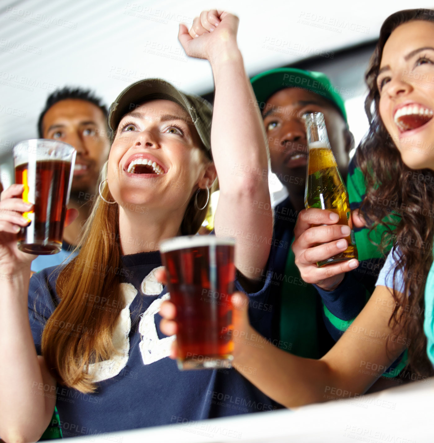 Buy stock photo Beer, sports fans and football match celebration in pub for goal score, team win and live entertainment. Excited people, happy hour and watching game with cheering, passion and support for tournament