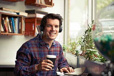 Buy stock photo Man, portrait and notebook with headphones in coffee shop for remote work, pride or tea in morning. Person, journalist or writer with book, drink and music subscription with smile for article in cafe