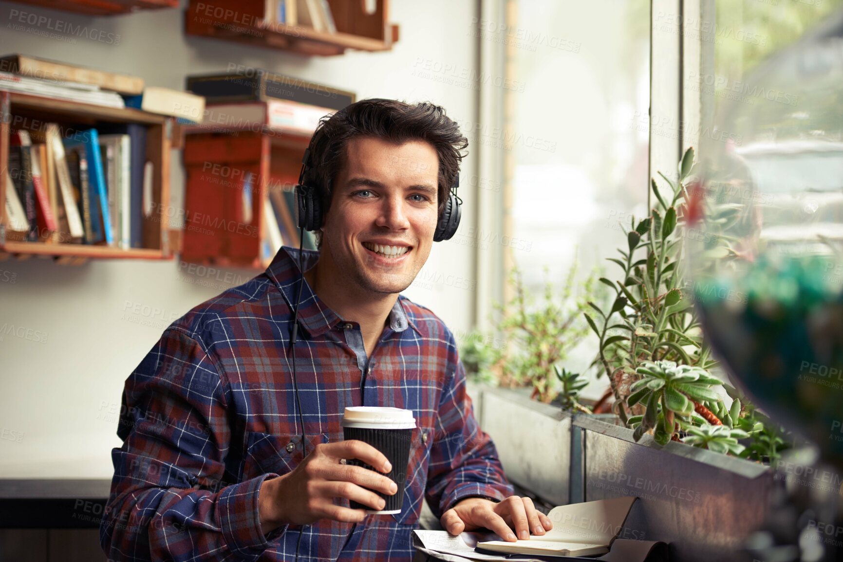 Buy stock photo Man, portrait and notebook with headphones in coffee shop for remote work, pride or tea in morning. Person, journalist or writer with book, drink and music subscription with smile for article in cafe