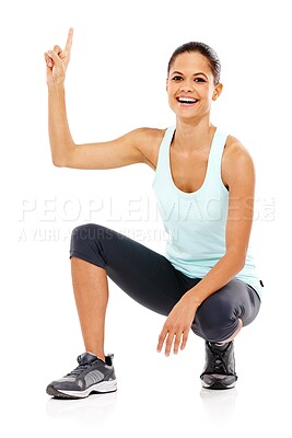 Buy stock photo Happy woman, portrait and pointing up with fitness for sports notification or advertising on a white studio background. Young female person showing alert with smile for marketing, health and wellness