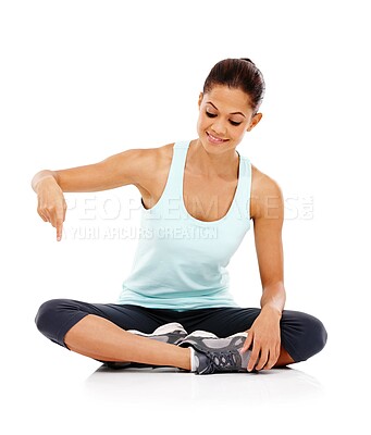 Buy stock photo Happy woman, pointing down and sports with fashion for finger or advertising gesture on a white studio background. Young female person showing alert with smile for marketing, health and wellness