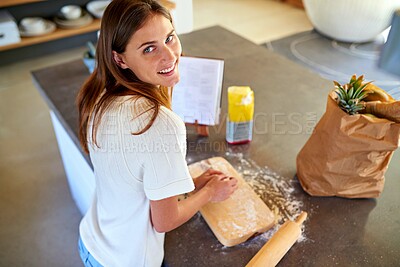 Buy stock photo Baking, home and portrait of woman with cookie dough, flour and homemade food for lunch. Diet, wellness and person at kitchen counter with groceries, nutrition and recipe book for bread ingredients