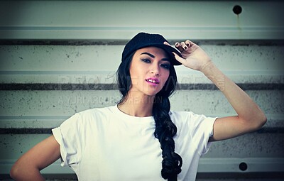 Buy stock photo Woman, portrait and cap with street style or wall background in city fashion, cool or confidence. Female person, face and trendy or urban downtown with clothes in New York or grunge, gen z or hat