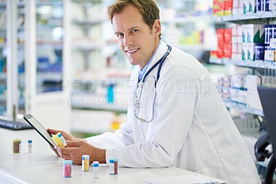 Buy stock photo Doctor, tablet and pills for telehealth, portrait or medicine in drugstore, chemist or services. Male person, pharmacist and pharmaceuticals in clinic for stock, inventory for information or advice
