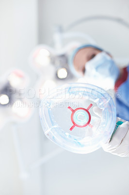 Buy stock photo Oxygen, mask and surgeon in operation in theatre for anaesthesia safety, emergency procedure and ppe. Below, doctor and gas machine for sleeping, surgery and medical treatment with healthcare service