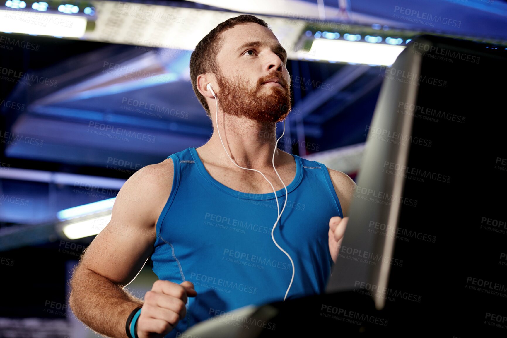 Buy stock photo Earphones, runner and man running on treadmill in gym for health, wellness and body weight loss. Exercise, fitness and male athlete with cardio workout on machine for race training in sports center.