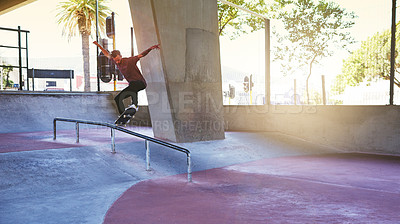 Buy stock photo Jump, skateboard and rail with man at park for urban, extreme sports and trick flips. Street league, balance and fitness with person and skating for grind in city with youth, energy and hobby