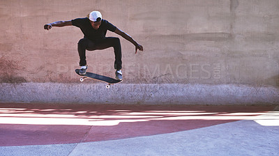 Buy stock photo Energy, skateboard and jump with man at park for urban, extreme sports and trick flips. Street league, balance and fitness with person and skating for ollie in city with youth, culture and hobby