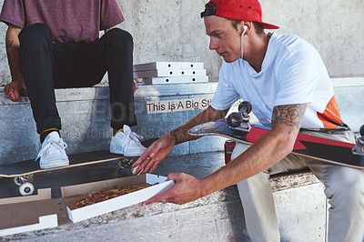 Buy stock photo Man, skater and friends with food outdoor for pizza lunch, fitness break and bonding with takeaway. People, nutrition meal and skateboard with sports recovery, hungry and exercise performance in city