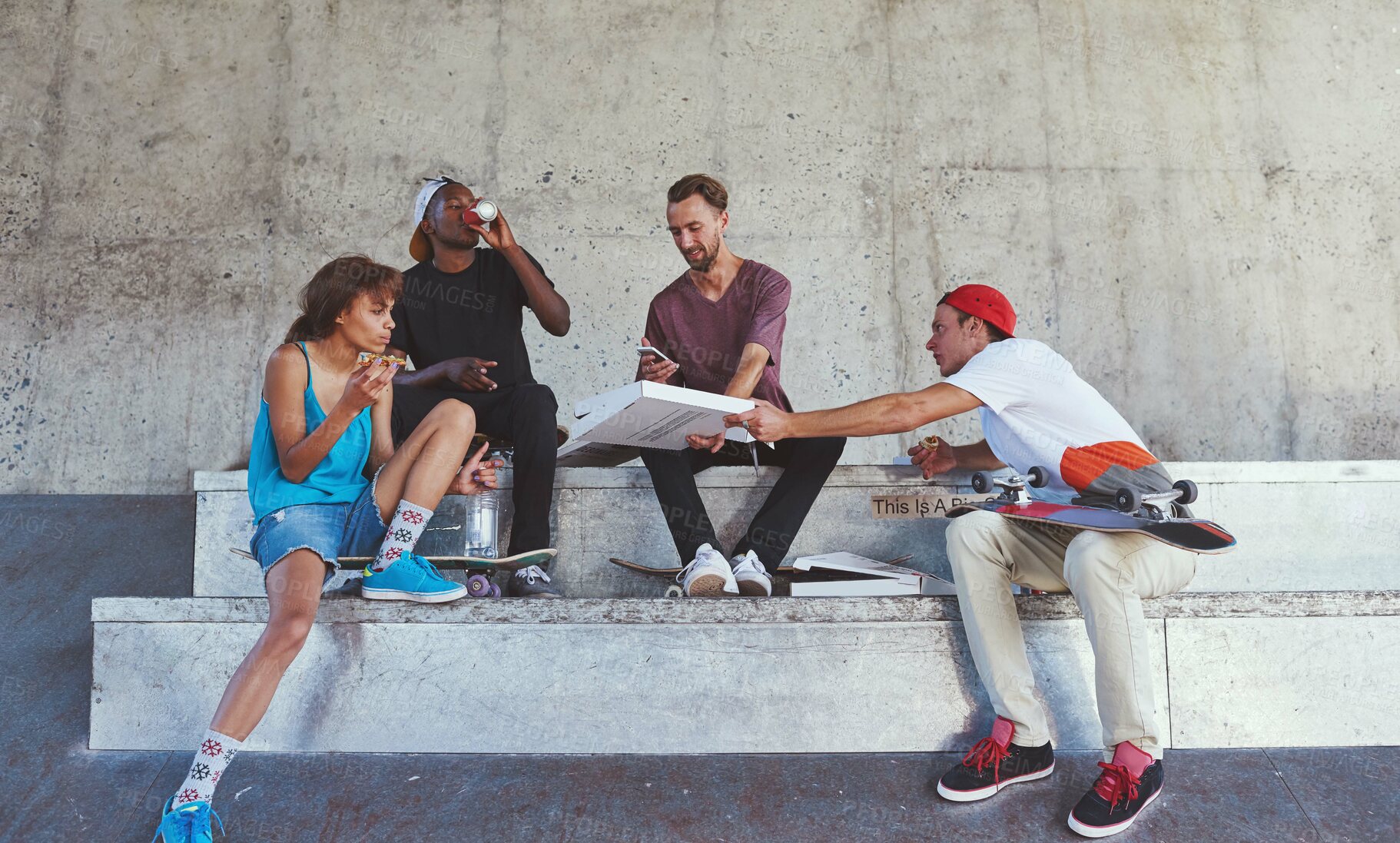 Buy stock photo Skater, friends and eating of food outdoor for pizza lunch, fitness break and bonding with takeaway. People, nutrition meal and skateboard for sports recovery, hungry and exercise performance in city