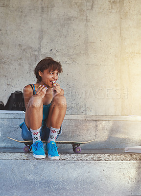 Buy stock photo City, eating and girl with skateboard, smile or break on street with food, breakfast or morning. Sport, outdoor and person with snack on road, training or Gen z with skills for competition or athlete