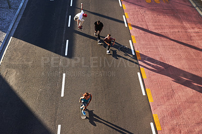 Buy stock photo Active, skating and friends with skateboard, road and race for group in city, fitness or drone. Outdoor, above and travel for competition on street, skateboarding and practice for game or people