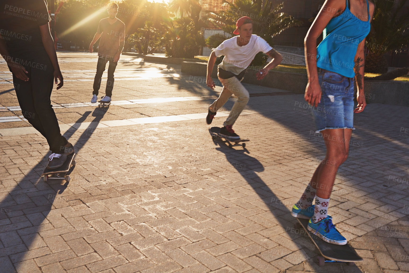 Buy stock photo Friends, skateboard sports and people in street, city or outdoors for fun practice. Exercise, fitness and group hobby with training and skaters bonding together on urban road for downtown workout