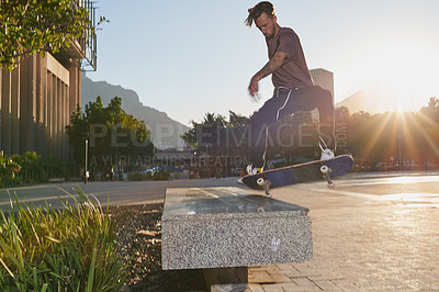 Buy stock photo Man, skateboard and city grind for fitness, street sports and alternative transport in town. Freestyle, hobby and person for urban adventure on weekend, practice and outdoor training with sun flare