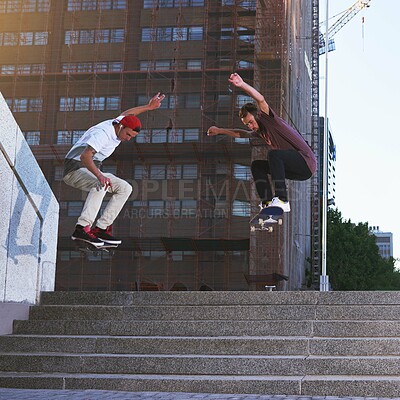 Buy stock photo Friends, skateboard stunt and jump in street, city or outdoors for practice. Men, steps and exercise trick with training, skaters and bonding together on urban road for downtown workout and fitness