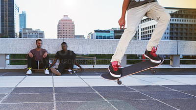 Buy stock photo Skateboard, legs and person with ollie flip in air for jump stunt, practice and energy in New York. Rooftop, fitness or skater in city with trick on concrete for talent, skill competition or hobby