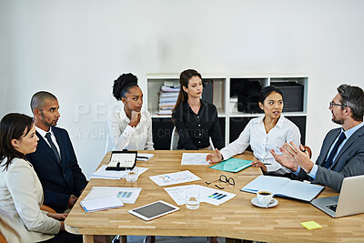 Buy stock photo Business people, meeting and discussion with paperwork for finance with annual strategy, statistics and planning. Teamwork, documents or diversity with tech, brainstorming and infographic analysis