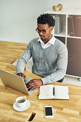 Buy stock photo Business, black man and typing in office with laptop or journal for daily schedule or planning for time management. Male entrepreneur, serious and notebook in workplace for ideas, thoughts and search