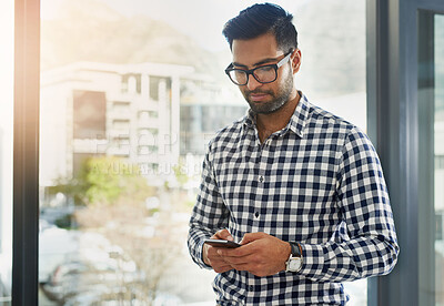 Buy stock photo Businessman, coffee or phone in office for texting or news, email for big idea at window. Male consultant or espresso in workplace with mobile for communication, typing with advice for company