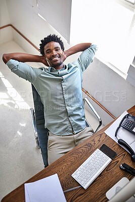 Buy stock photo Black man, portrait and relax with break above for completion, done or finished at office. Top view of young African or business employee sitting back in satisfaction or confidence for job success