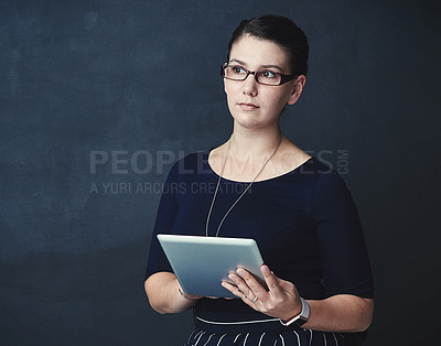 Buy stock photo Business woman, web designer and thinking with tablet in studio for research or design on a dark background. Female person, thoughtful model or creative employee with technology or glasses on space