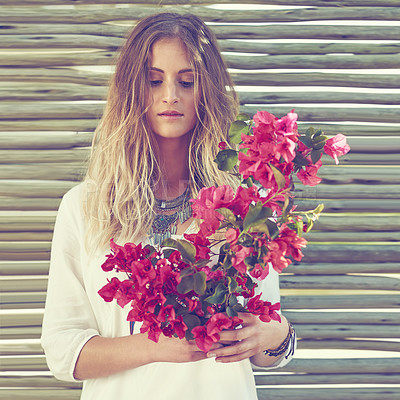 Buy stock photo Bohemian, fashion and woman with flowers outdoor for sustainable, casual and hipster clothes. Gypsy, blossom and female person with pink bogainvillea floral bouquet in spring with eco friendly style.