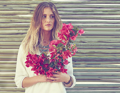 Buy stock photo Bohemian, style and woman with flowers outdoor for sustainable, casual and hipster clothes. Gypsy, blossom and female person with pink bogainvillea floral bouquet in spring with eco friendly fashion.