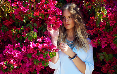 Buy stock photo Woman, thinking and flowers for fashion outdoor for nature scent, sustainable beauty and casual clothes. Female person, jewellery and pink plants with summer season, stylish outfit and vacation peace