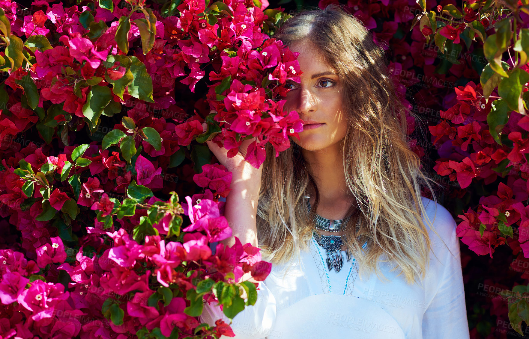 Buy stock photo Woman, thinking and nature flowers for fashion with aesthetic, sustainable beauty and casual clothes. Female person, jewellery and ideas with pink plants of summer season, stylish outfit and blooming