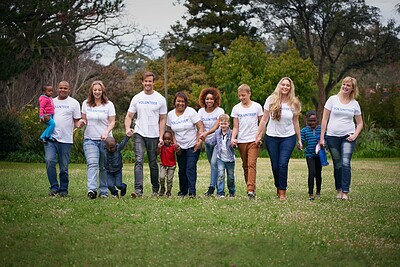 Buy stock photo Charity, children and community with volunteer people in the park together for humanitarianism or activism. Nature, support or teamwork with adults and kids cleaning their environment for social work