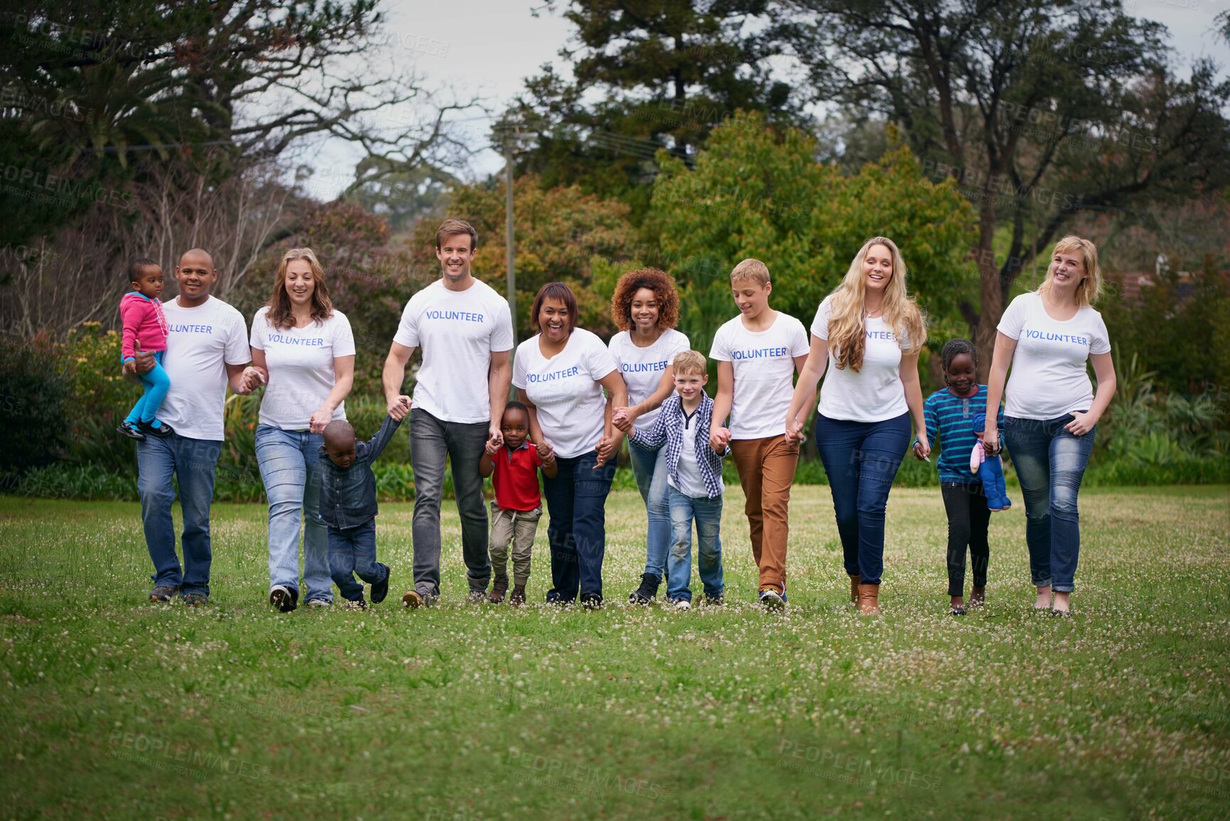 Buy stock photo Charity, children and community with volunteer people in the park together for humanitarianism or activism. Nature, support or teamwork with adults and kids cleaning their environment for social work