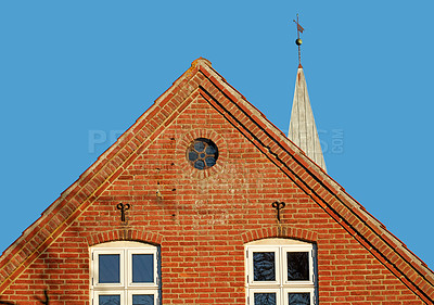 Buy stock photo Architecture, windows and church with building in city for religion, worship and history in town. Brick wall, exterior and urban with catholic temple outdoor for God, spiritual or cathedral