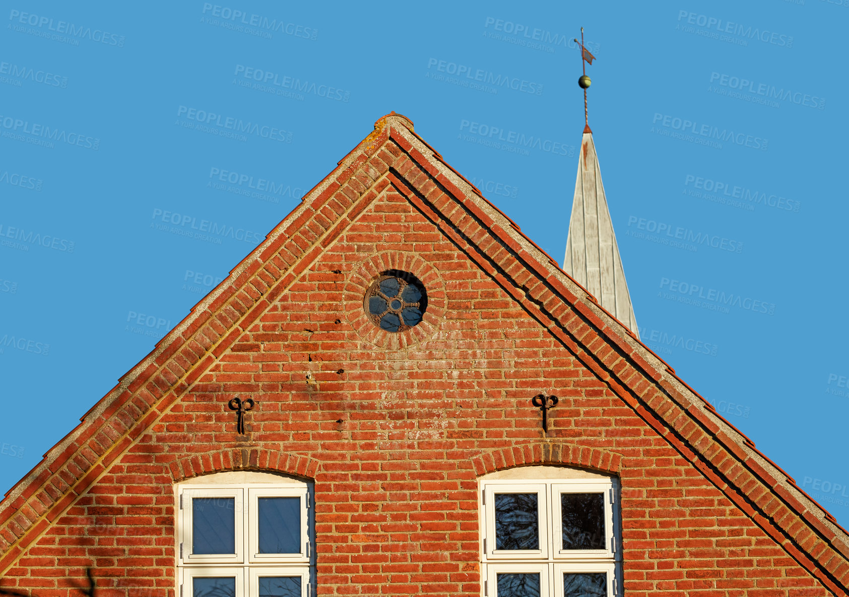 Buy stock photo Architecture, windows and church with building in city for religion, worship and history in town. Brick wall, exterior and urban with catholic temple outdoor for God, spiritual or cathedral