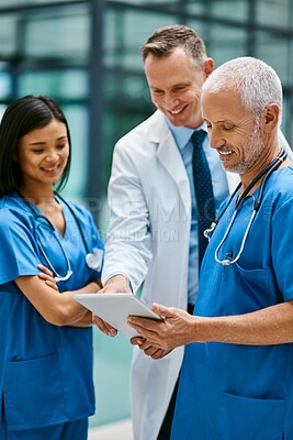 Buy stock photo Doctor, team and tablet in hospital for medicine, medical research and planning online schedule. People, smile and confident for healthcare, cardiologist and clinic website for expert medicare