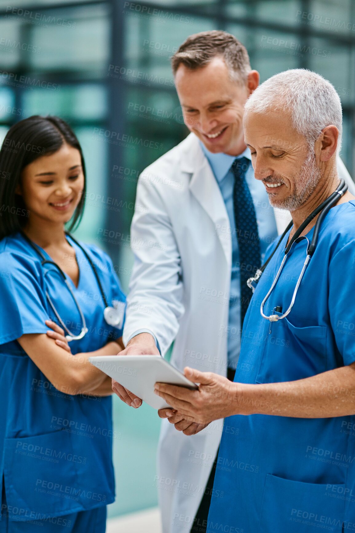 Buy stock photo Doctor, team and tablet in hospital for medicine, medical research and planning online schedule. People, smile and confident for healthcare, cardiologist and clinic website for expert medicare