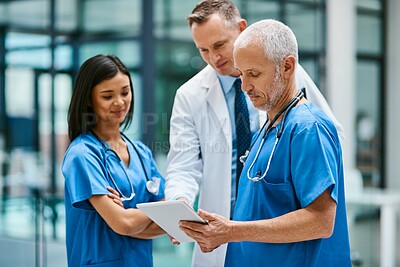 Buy stock photo Doctor, nurse and hospital with tablet for research or telehealth communication or online, consultation or digital. Men, woman and medical app as client conversation or internet, website or insurance