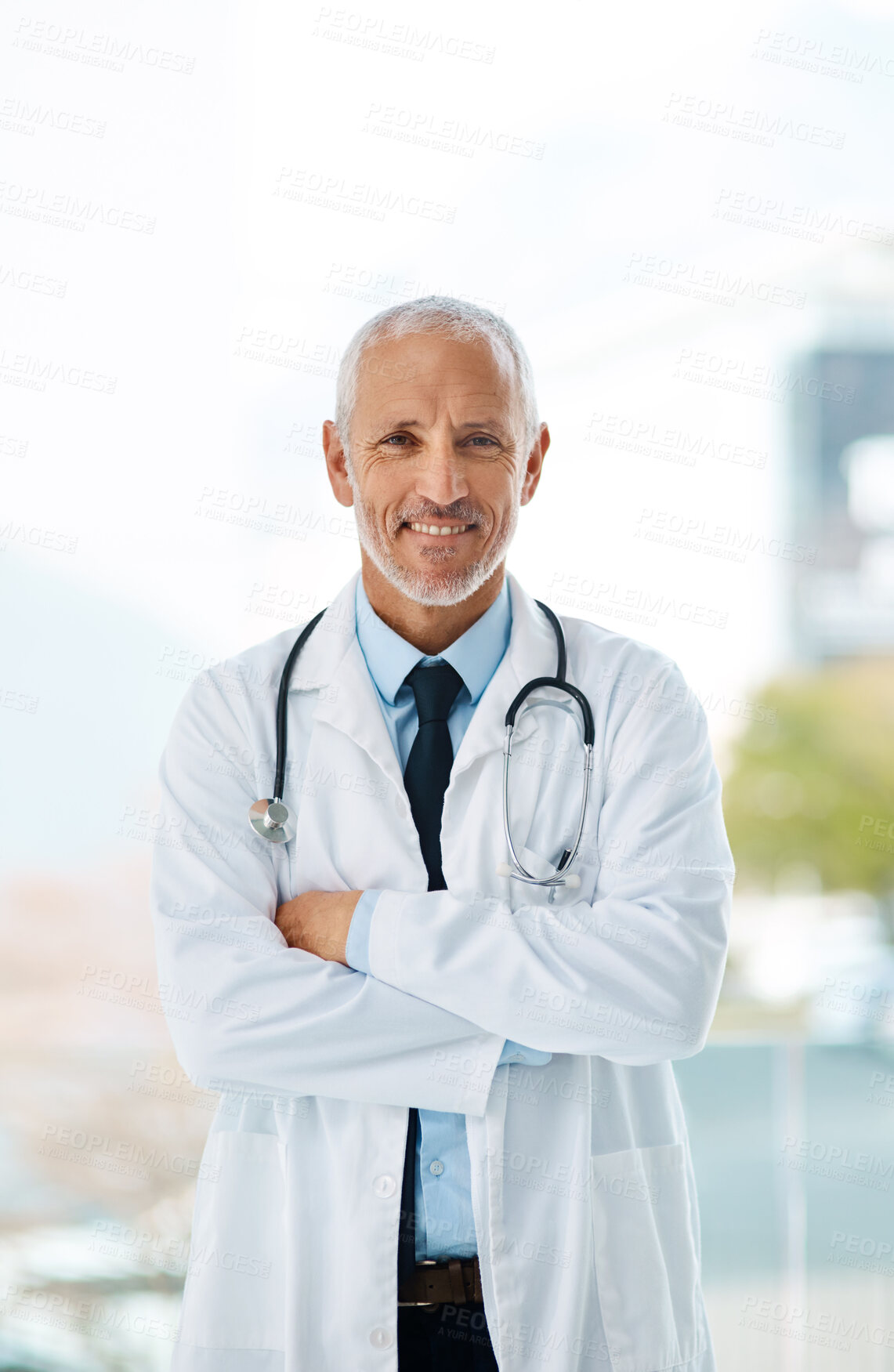 Buy stock photo Doctor, confidence and portrait of mature man in a hospital at cardiology clinic with arms crossed. Professional, medical employee and stethoscope with healthcare, job and cardiologist consultant