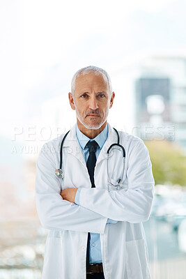 Buy stock photo Doctor, serious and portrait of mature man in a hospital ready for surgery with arms crossed. Professional, medical employee and stethoscope with healthcare, wellness and cardiologist consultant