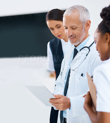 Buy stock photo Mature man, tablet and medical report with doctor in a hospital with team of healthcare workers and tech. Clinic, cardiology research and digital results with smile and collaboration with discussion