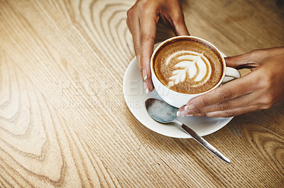 Buy stock photo Hands, latte art and space with person in coffee shop for hospitality, relax or service. Artistic, beverage and wooden table with customer in cafe or restaurant for morning caffeine drink from above