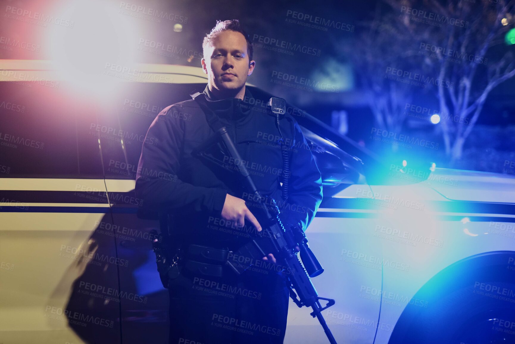 Buy stock photo Police officer, portrait and rifle for protection service by vehicle at night for law enforcement, city patrol and crime prevention. Public safety, man in uniform and cop in neighborhood for security