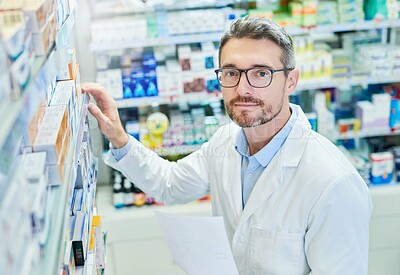 Buy stock photo Pharmacy, healthcare and portrait with man and shelf for pills, advice and medicine inspection. Medical, insurance and antibiotic search with pharmacist for inventory, drugstore and dispensary