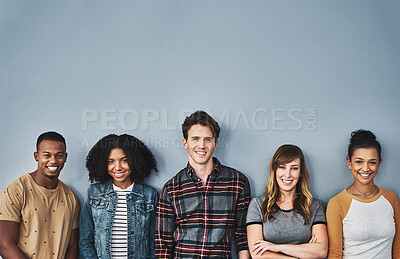 Buy stock photo Young people, portrait and students with smile in studio, row or line for academic sign up on a gray background. Happy group, learners or creative community with mockup space for college opportunity