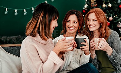 Buy stock photo Christmas, friends and women on sofa with cacao for relax, festive season or tradition in living room. Xmas tree, reunion and female people for December holiday, winter break or celebration in home